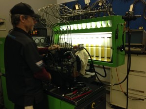 Island Diesel pump technician calibrating a 12 Cylinder Bosch P-Pump
